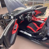 Red and black sports car cabin after interior detailing